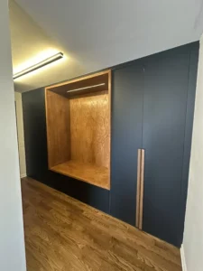 Photo of an oak built-in unit in a newly remodeled room.